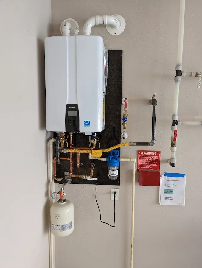 Professional plumber installing copper piping in a Fort Hunt home